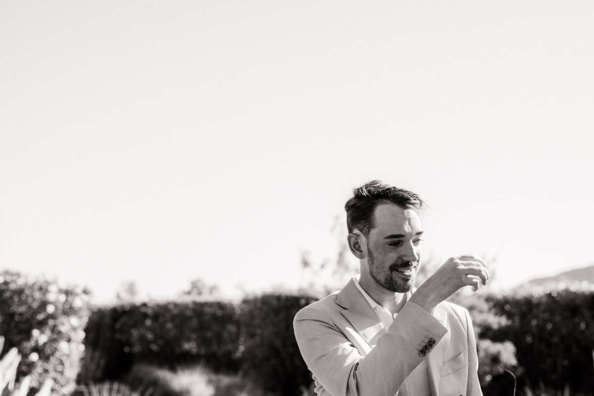 Groom wiping away tears as he marries his best friend