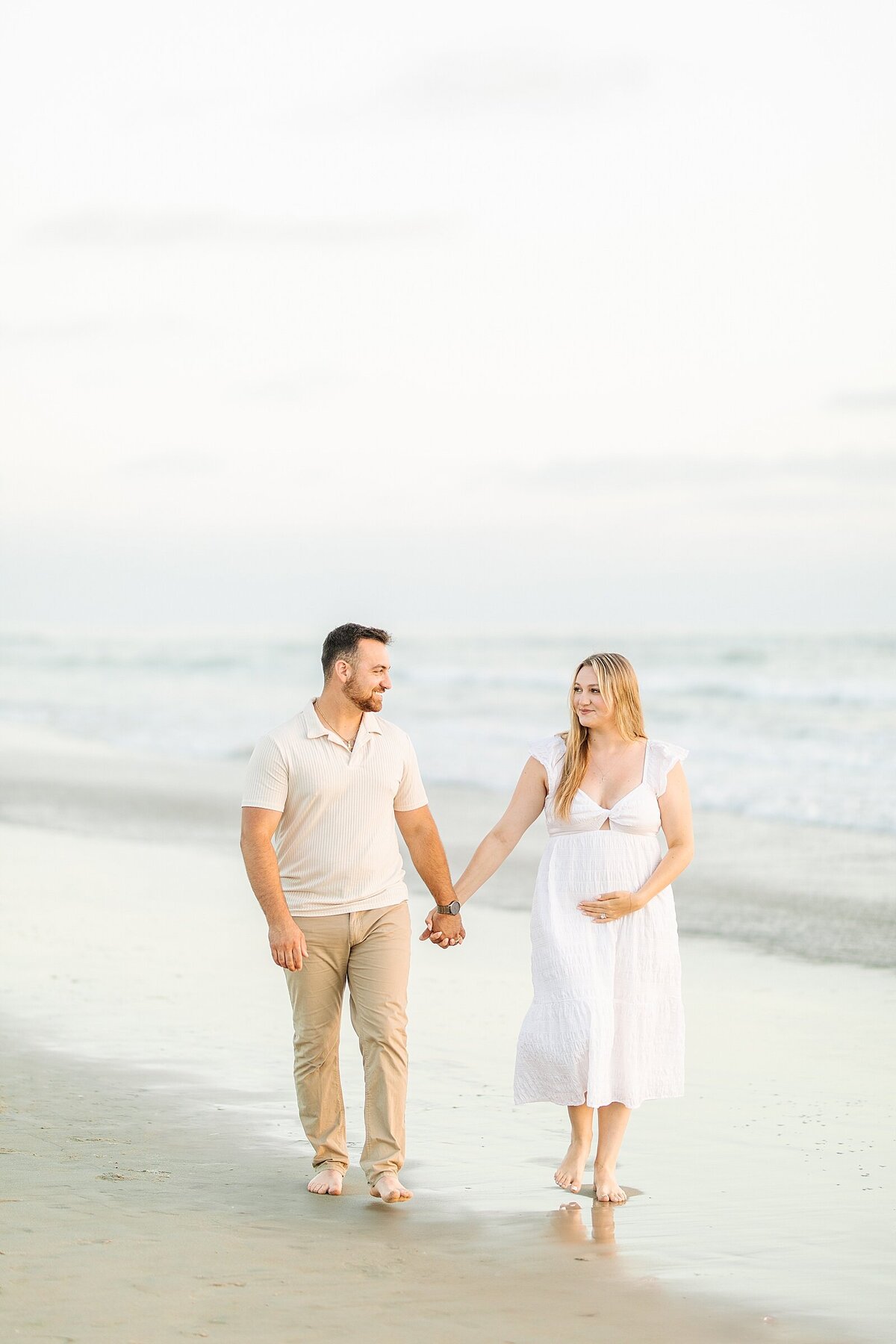 Pregnancy announcement  photography and videography session at Del Mar Beach in San Diego.