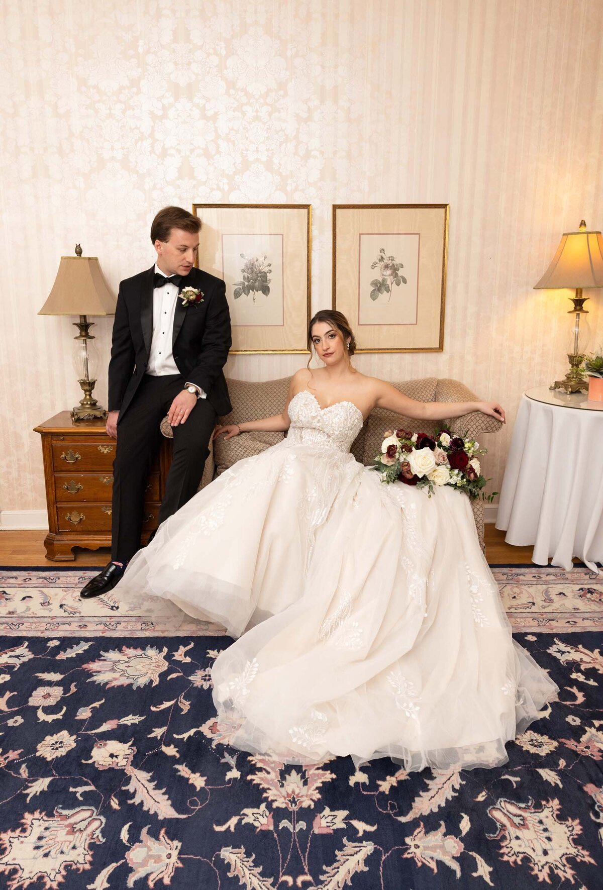 groom-looking-at-seated-bride-newlyweds