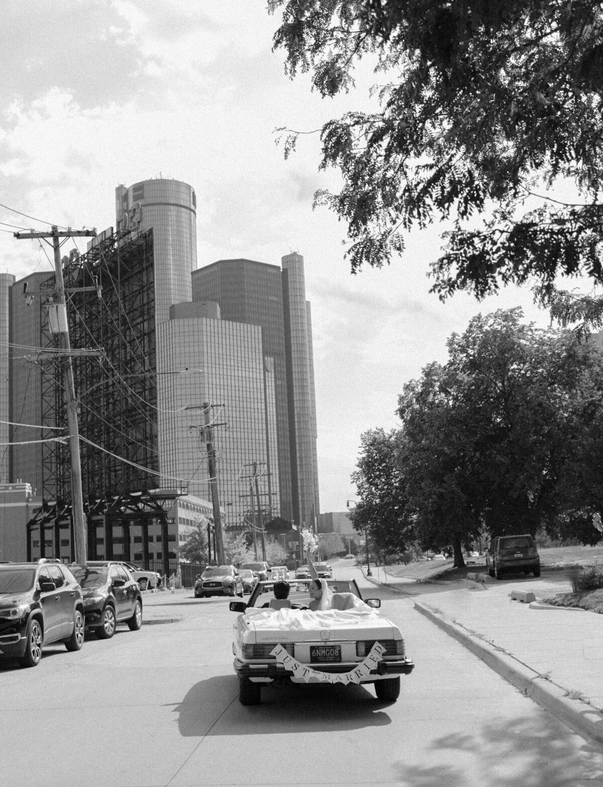 a couple drives off in their wedding getaway car in Detroit, Michigan
