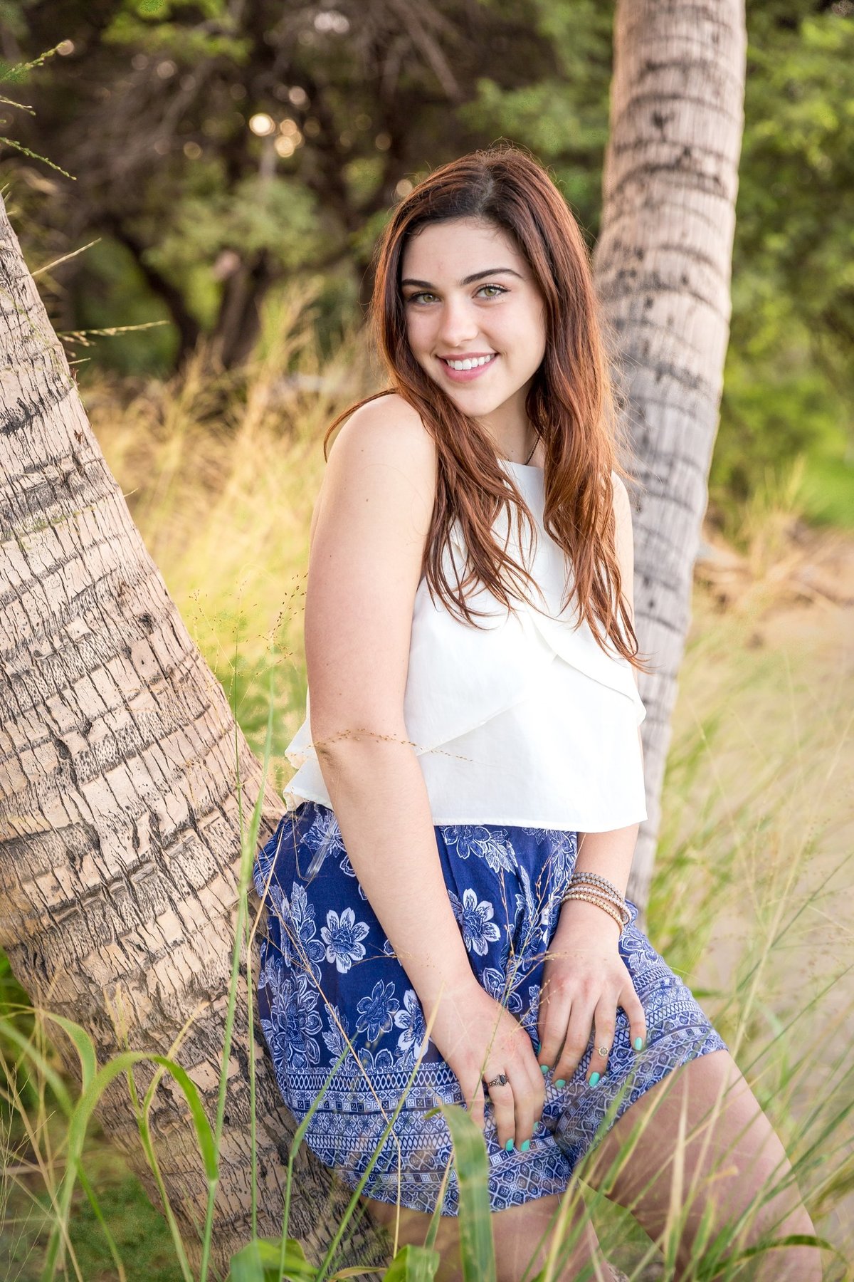 Capture Aloha Photography, Maui Senior Portrait Photography Standing on palm trees with grasses