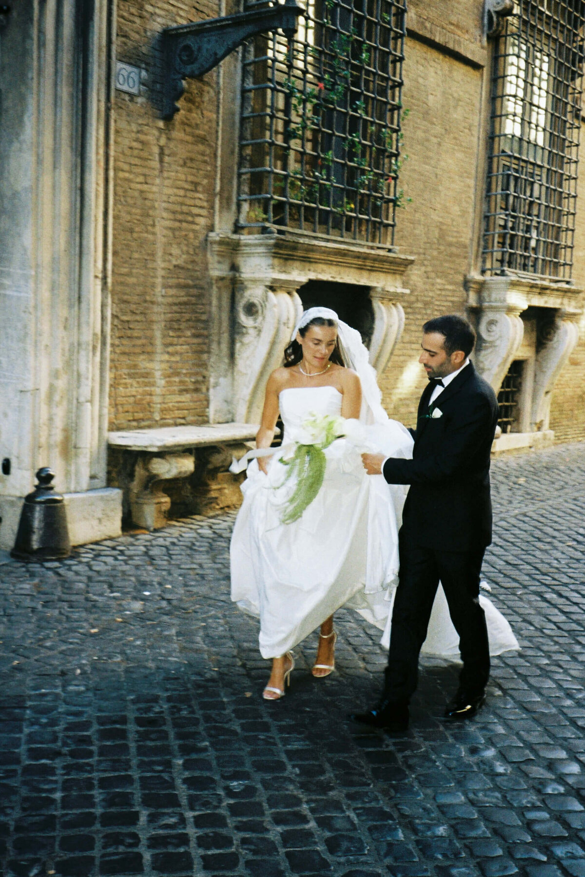 Couple walking joyfully hand in hand after wedding ceremony in Rome

