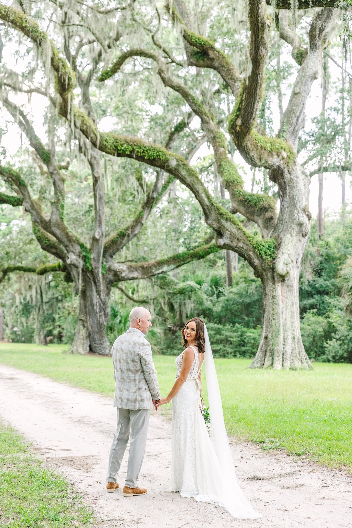 bride + groom under the oaks at sea pines