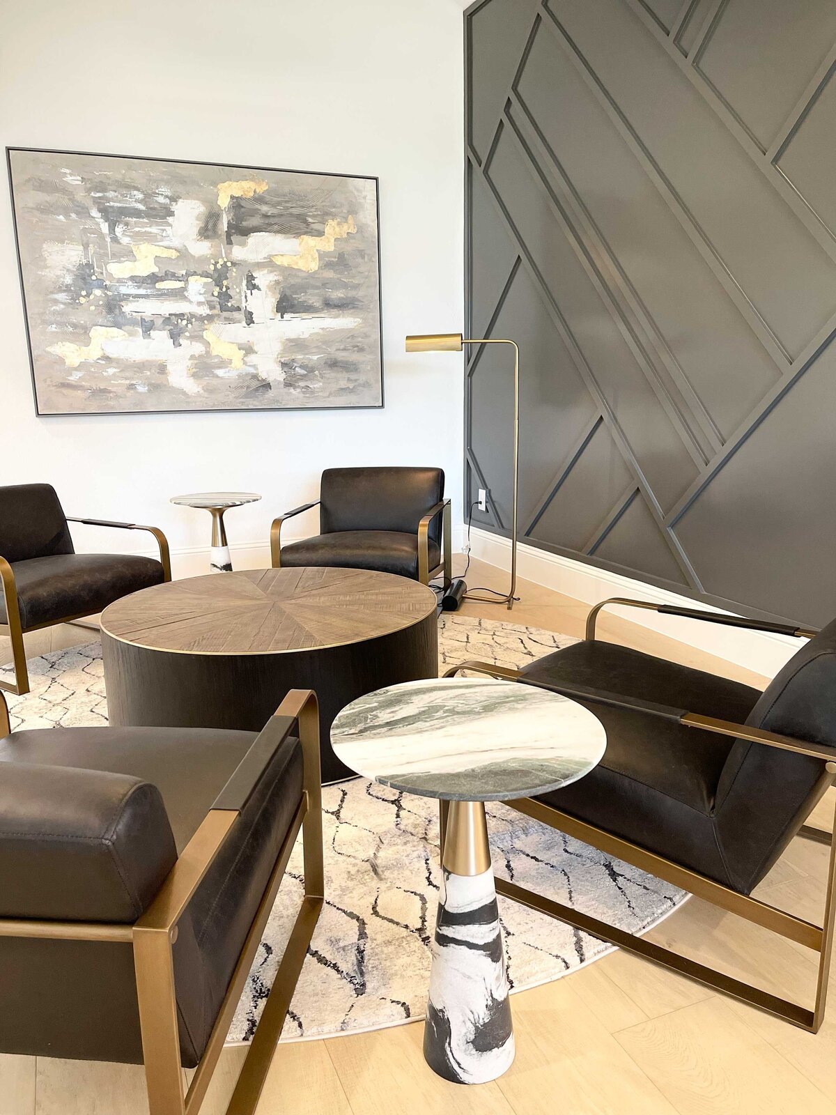 Renovation-focused interior contractor for a business meeting room featuring four elegant chairs and a stylish lamp, designed to reflect professionalism and create a productive, sophisticated atmosphere in the space.