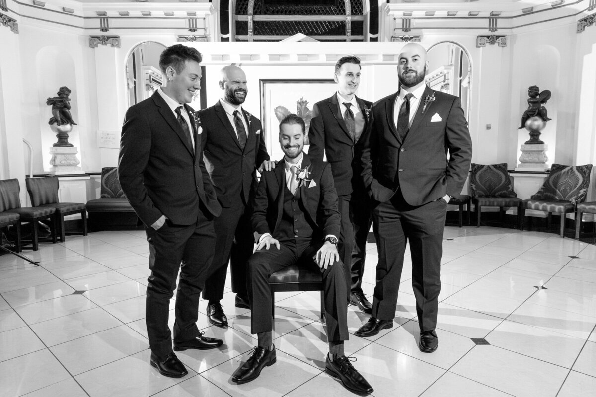 getting ready grooms men laughing and smiling before ceremony