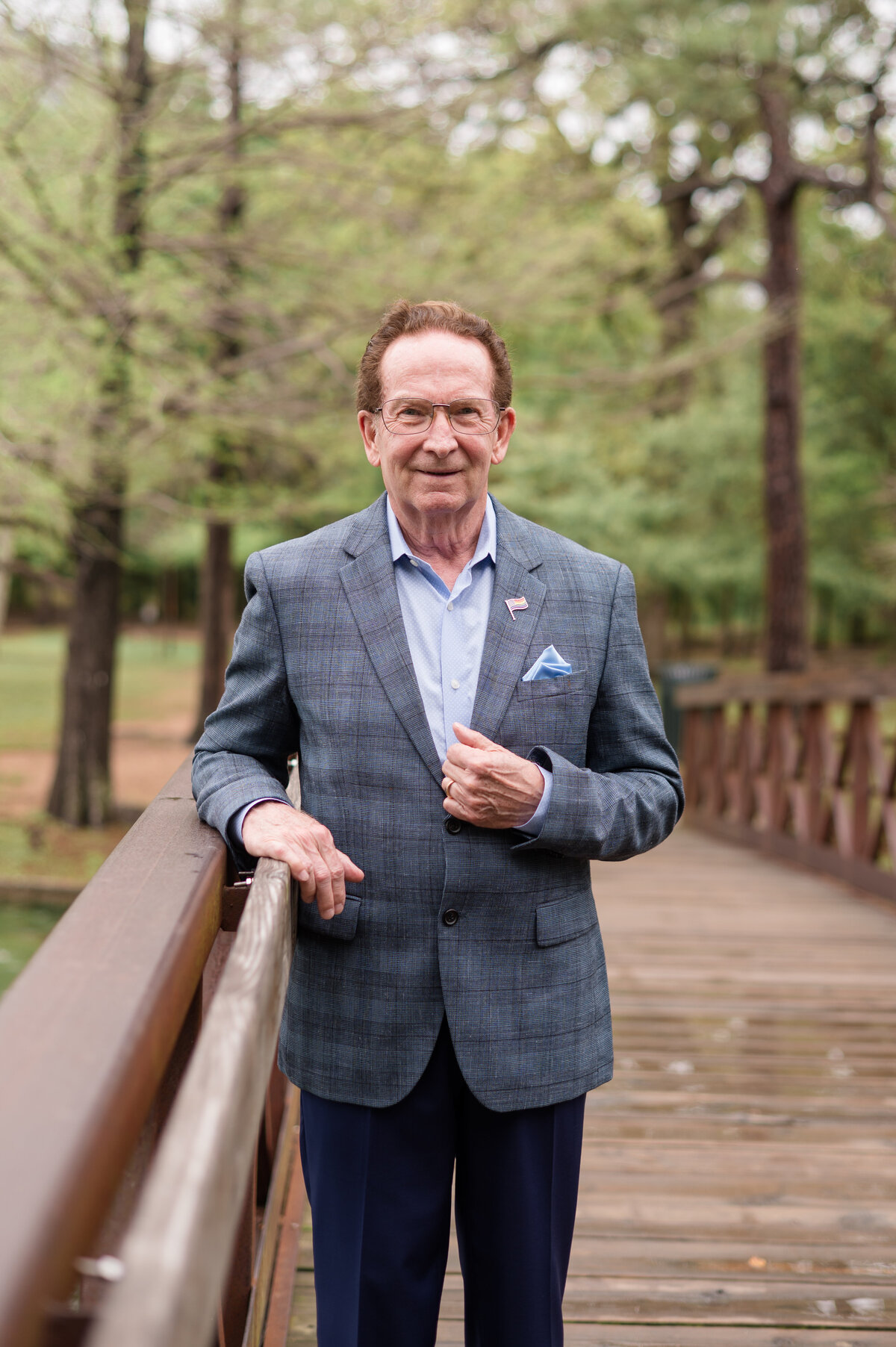 Business professional photo on park bridge by lifestyle photographer in Houston