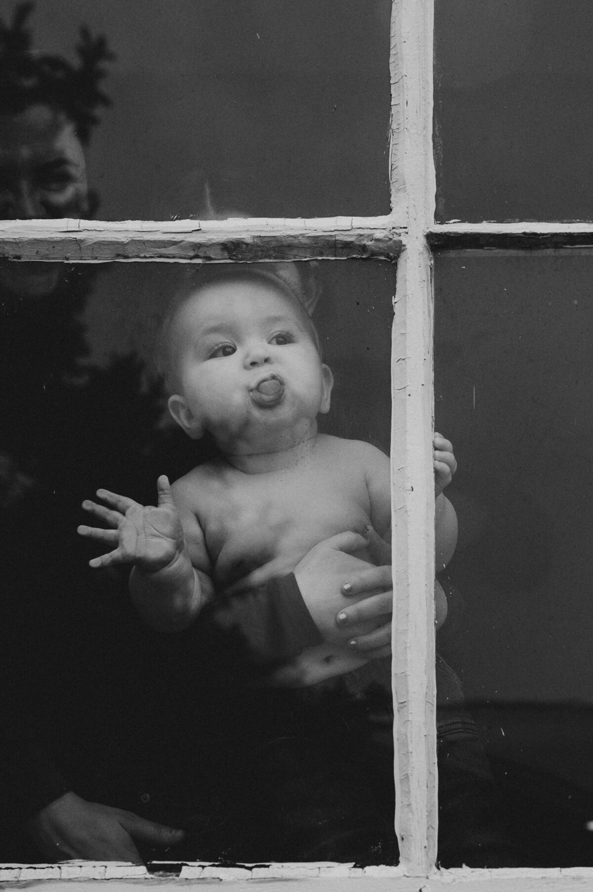 Baby kissing window