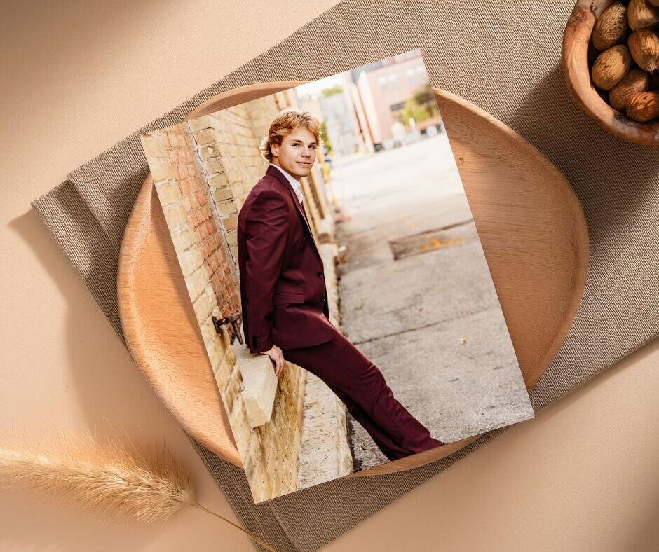 photo of a loose print of a high school senior boy laying out on a table 