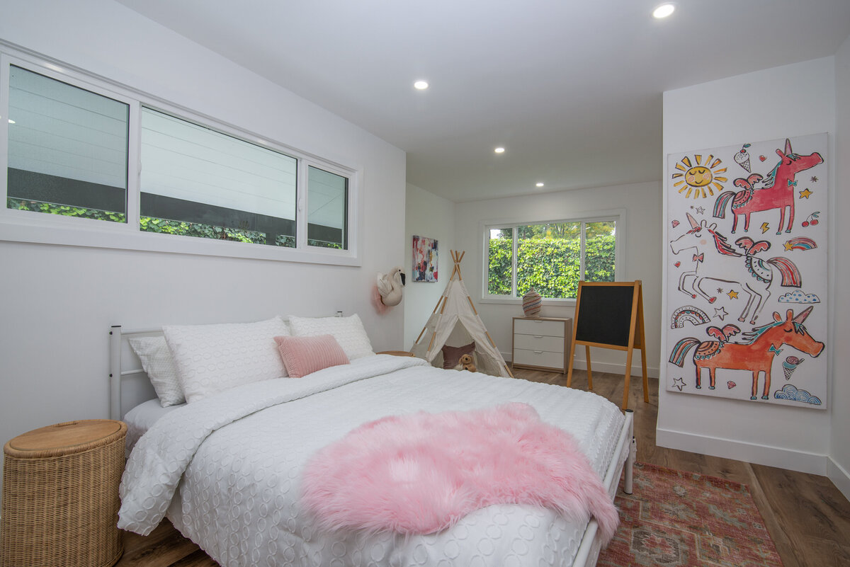 modern-bedroom-design-for-kids-white-walls-pink-accents-aw-development