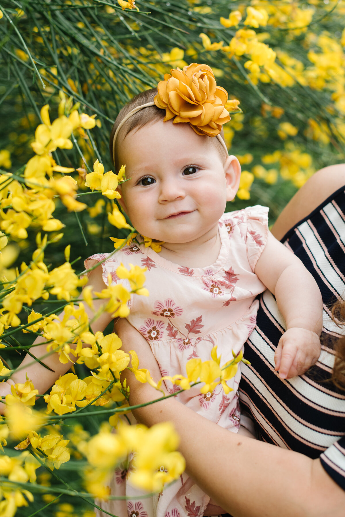 Baby girl with yellow flowers