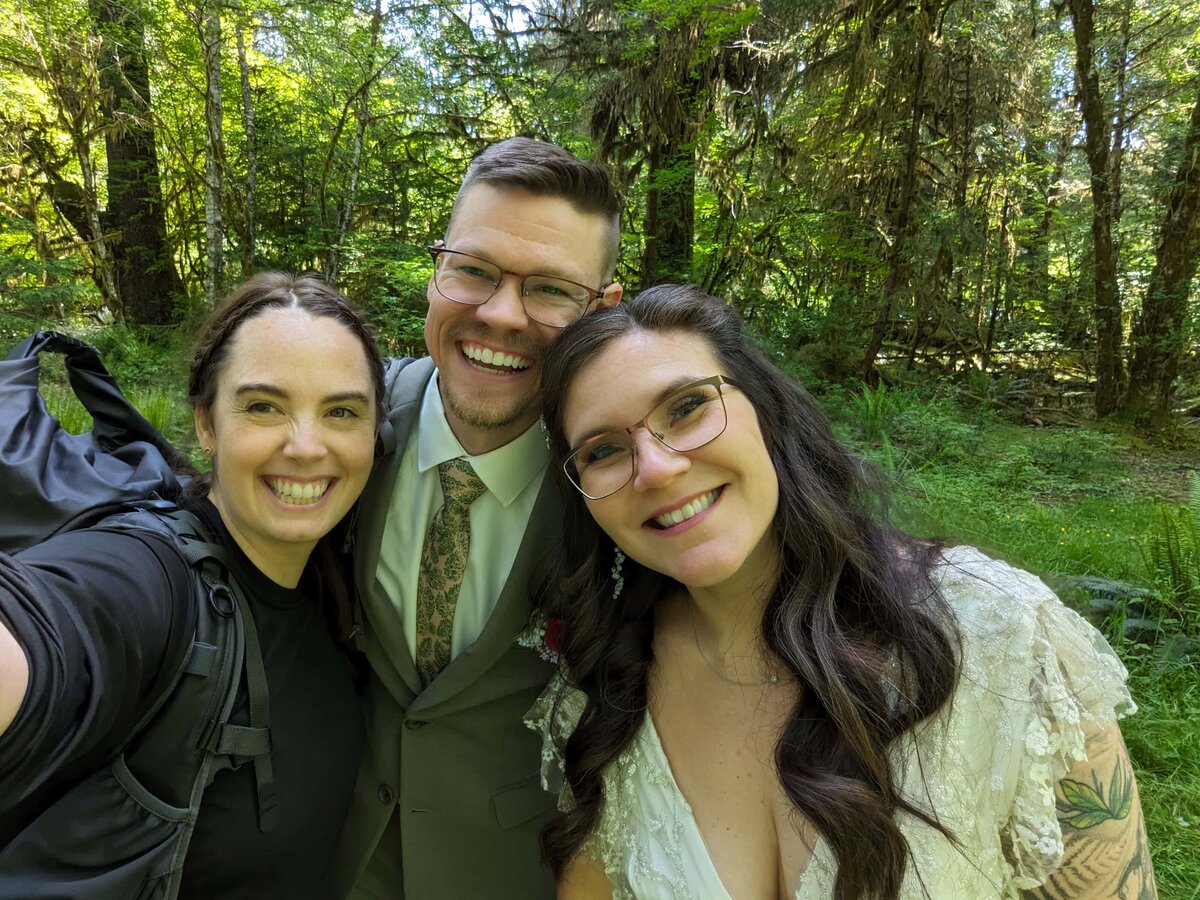 couple taking selfie after rainforest elopement