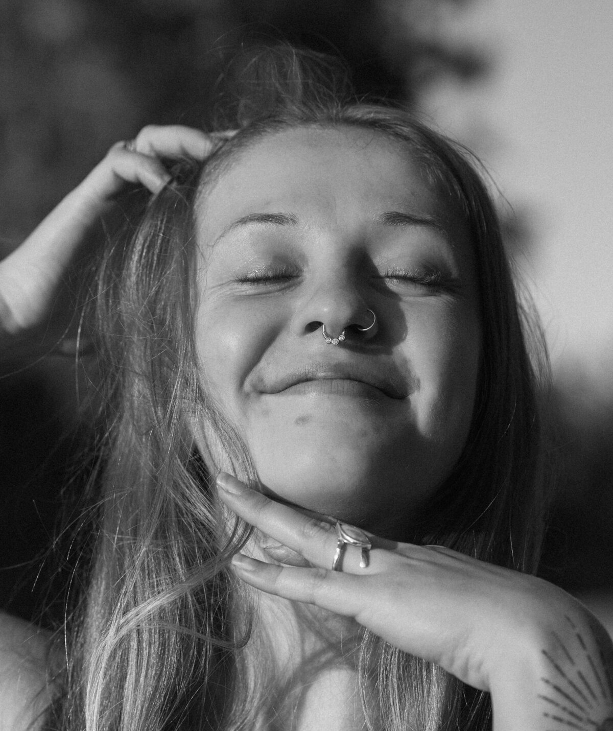 close up of female entrepreneur smiling and enjoying the sun on her face during an outdoor photoshoot in Bend, Oregon