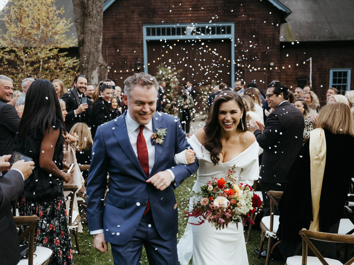 erica-renee-beauty-hair-and-makeup-duo-traveling-Berkshires-Stonover-Farm-Lenox-Brunette-soft-waves-glam-red-lip-long-sleeved-confetti-ceremony-couple-jason