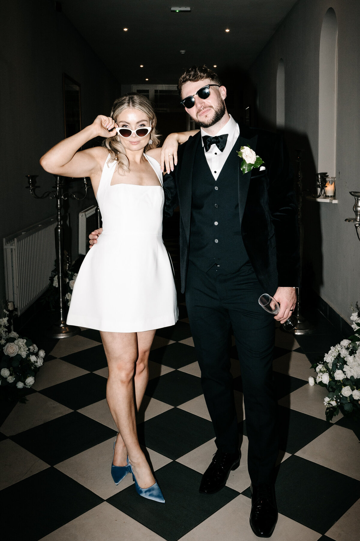 Bride and groom posing with their sunglasses on in Ireland