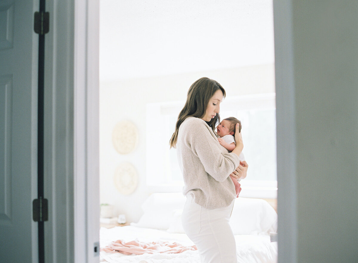 Seattle family photos, daughter and father candid on film in all white studio.