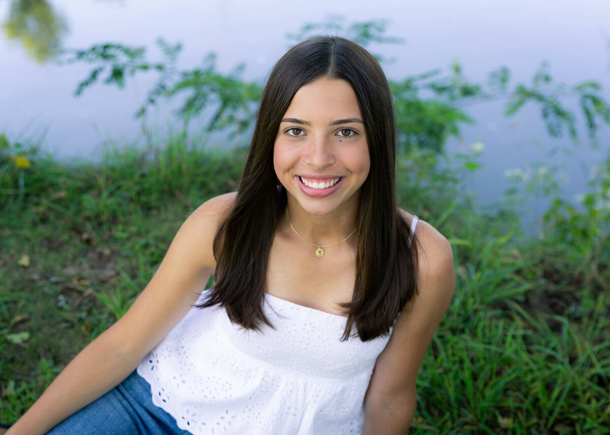 Senior pictures in a white top by the Erie canal