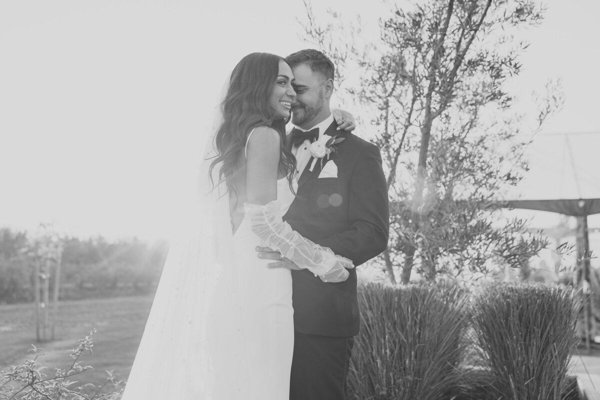bride and groom smiling walking down the aisle