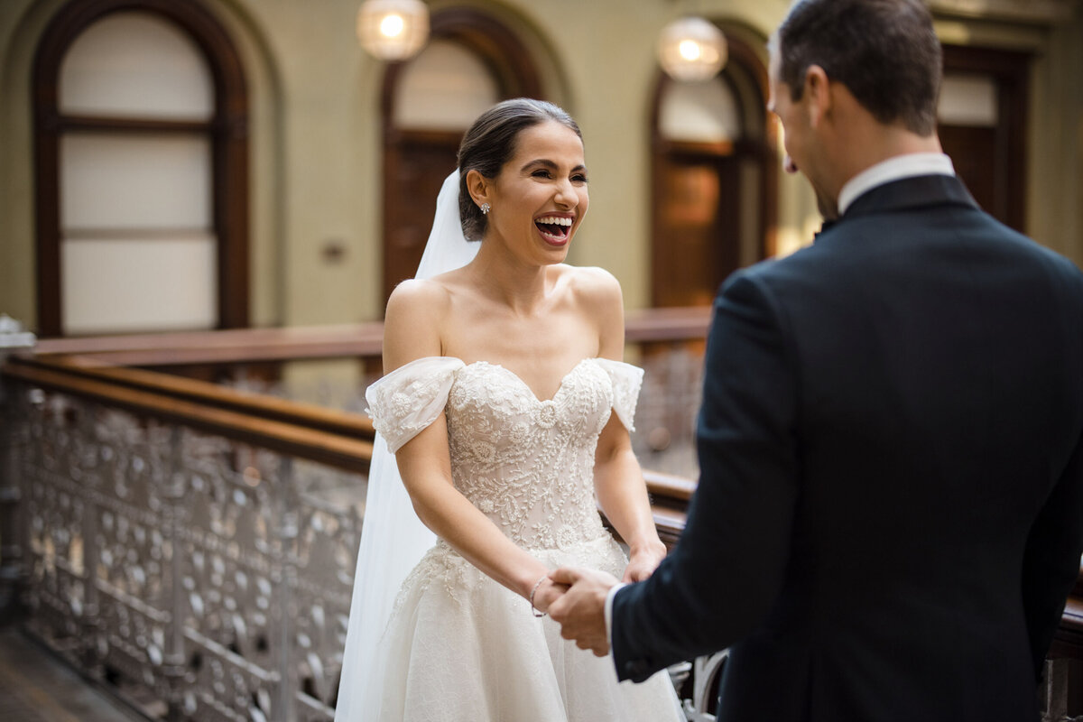 A bride and groom see each other for the first time in the atrium  at a Beekman Hotel wedding