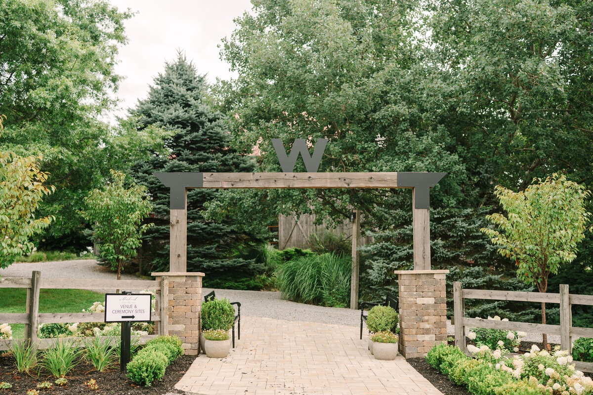 Wedding ceremony in a modern white winery style barn at Willowbrook