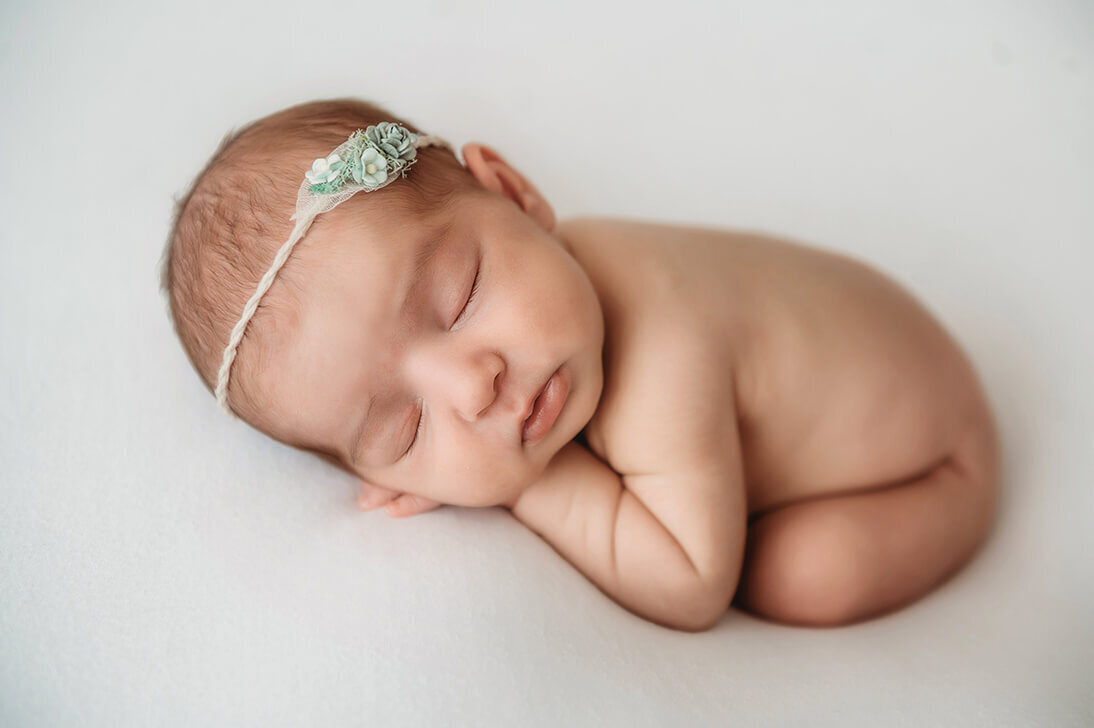 Infant posed for Newborn Photos in Asheville.