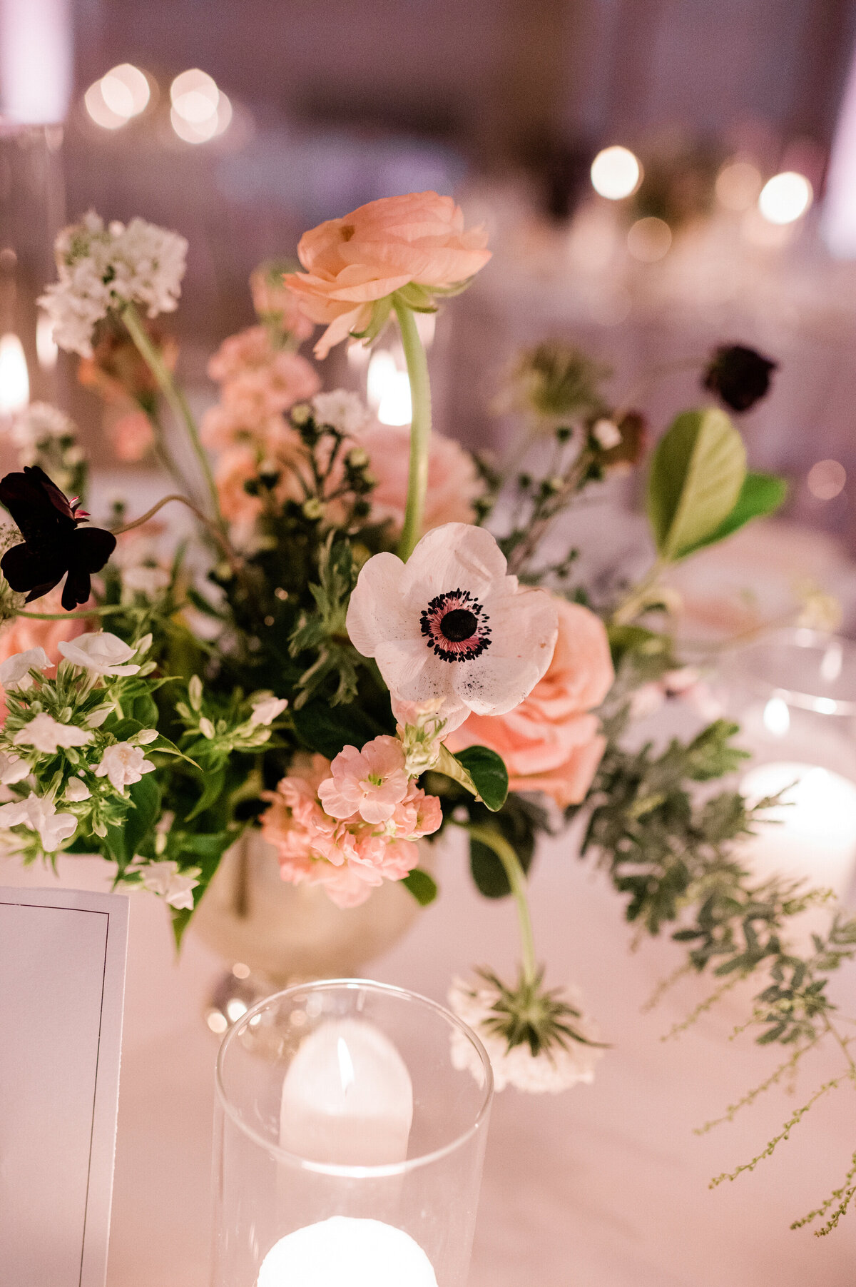 Beautiful glowing candle and flower centerpiece 