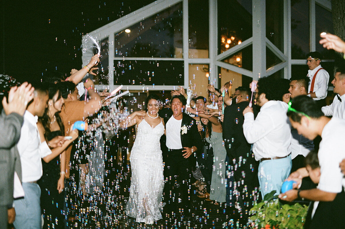 bride and groom bubble exit at their minnesota wedding