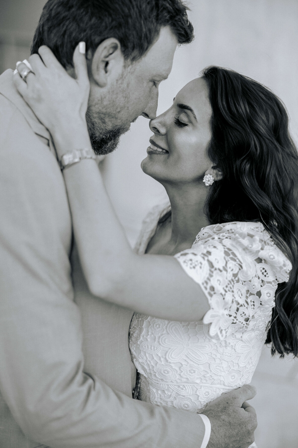 engaged-couple-embracing-about-to-kiss