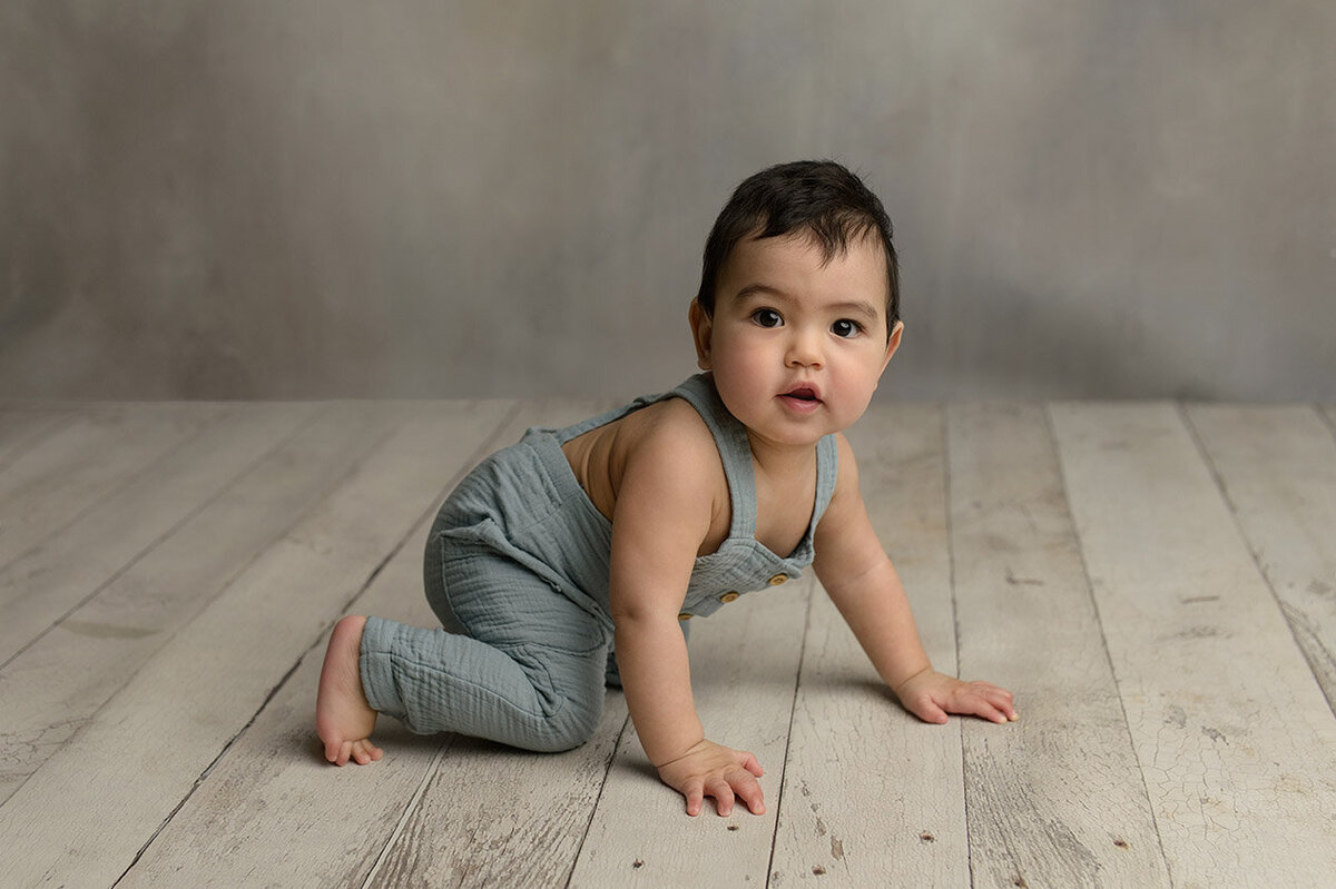 baby boy learning to crawl