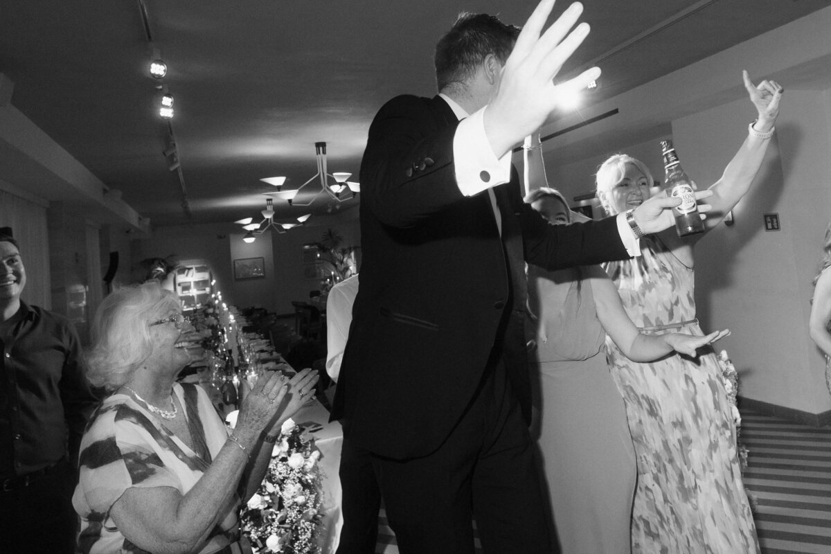 High-energy wedding reception with packed dance floor in Rome

