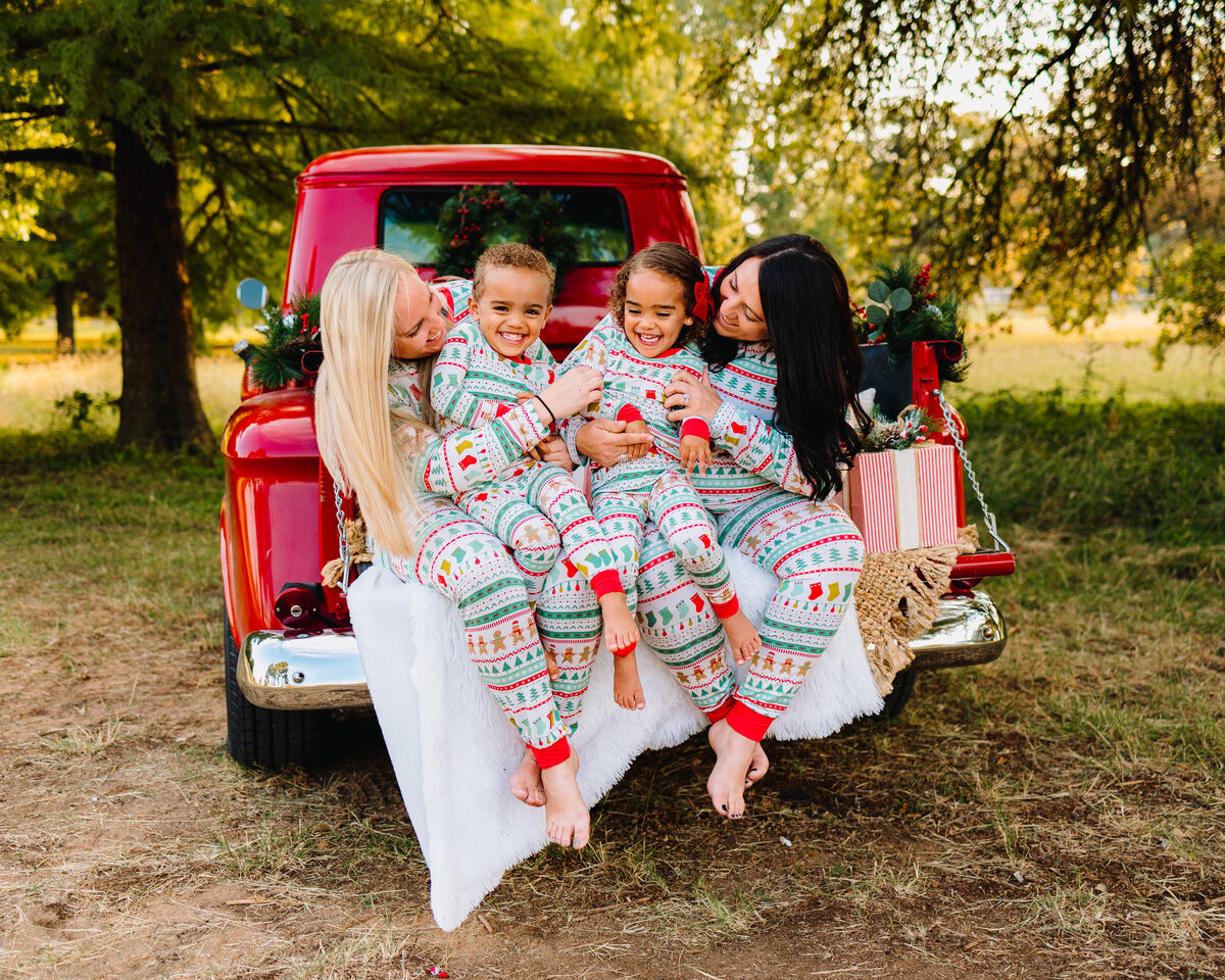 A family is posing for a holiday mini professional session
