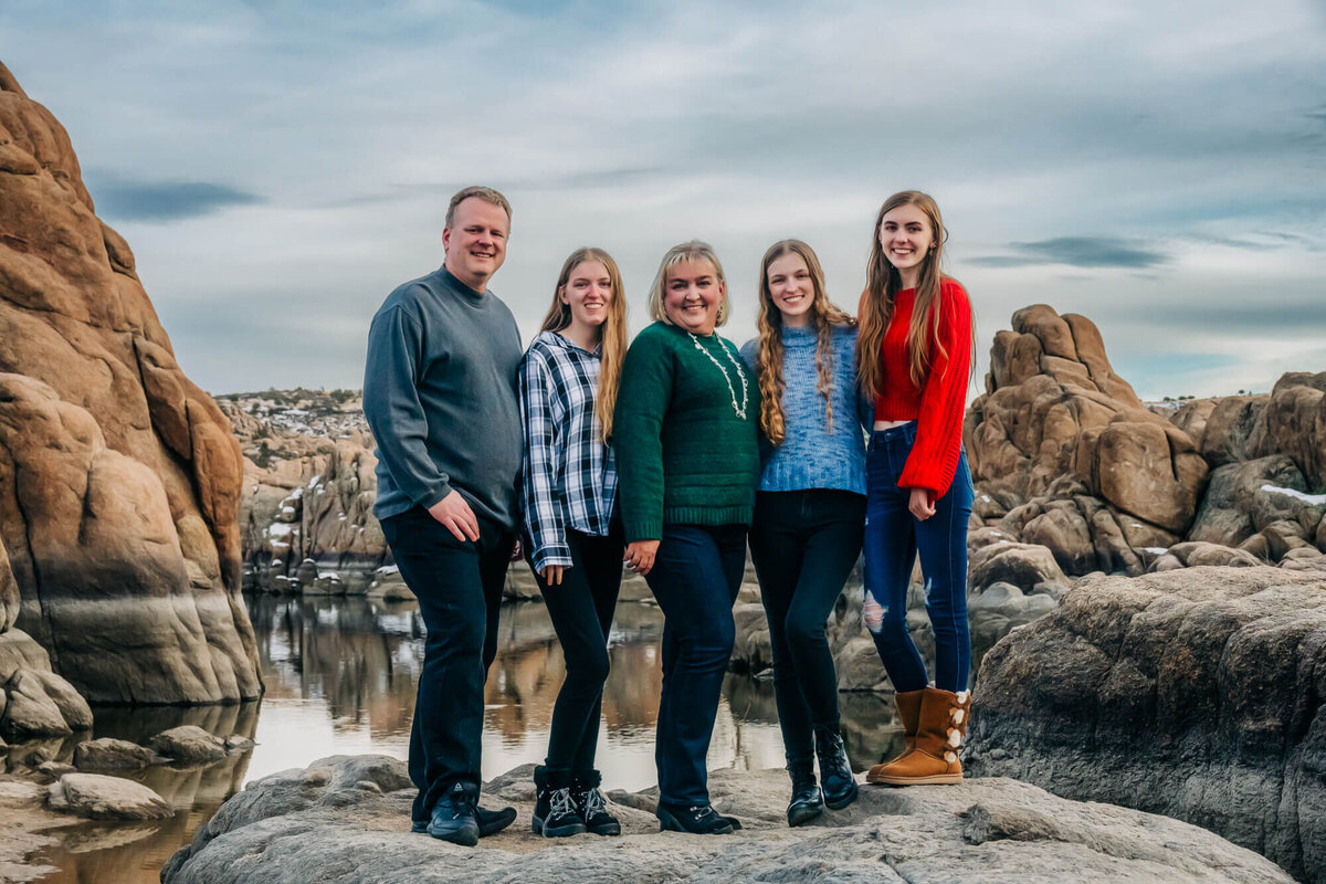 Family poses at Watson Lake in winter for Prescott family photographer Melissa Byrne