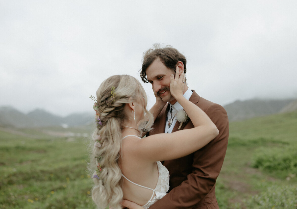 Woman holding onto her partners face.