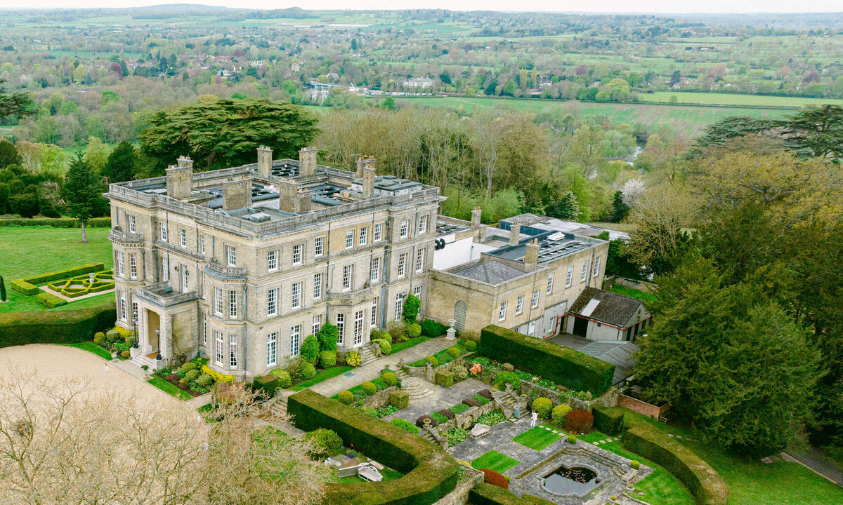 A wedding day drone photo of the wedding venue Hedsor House in the UK