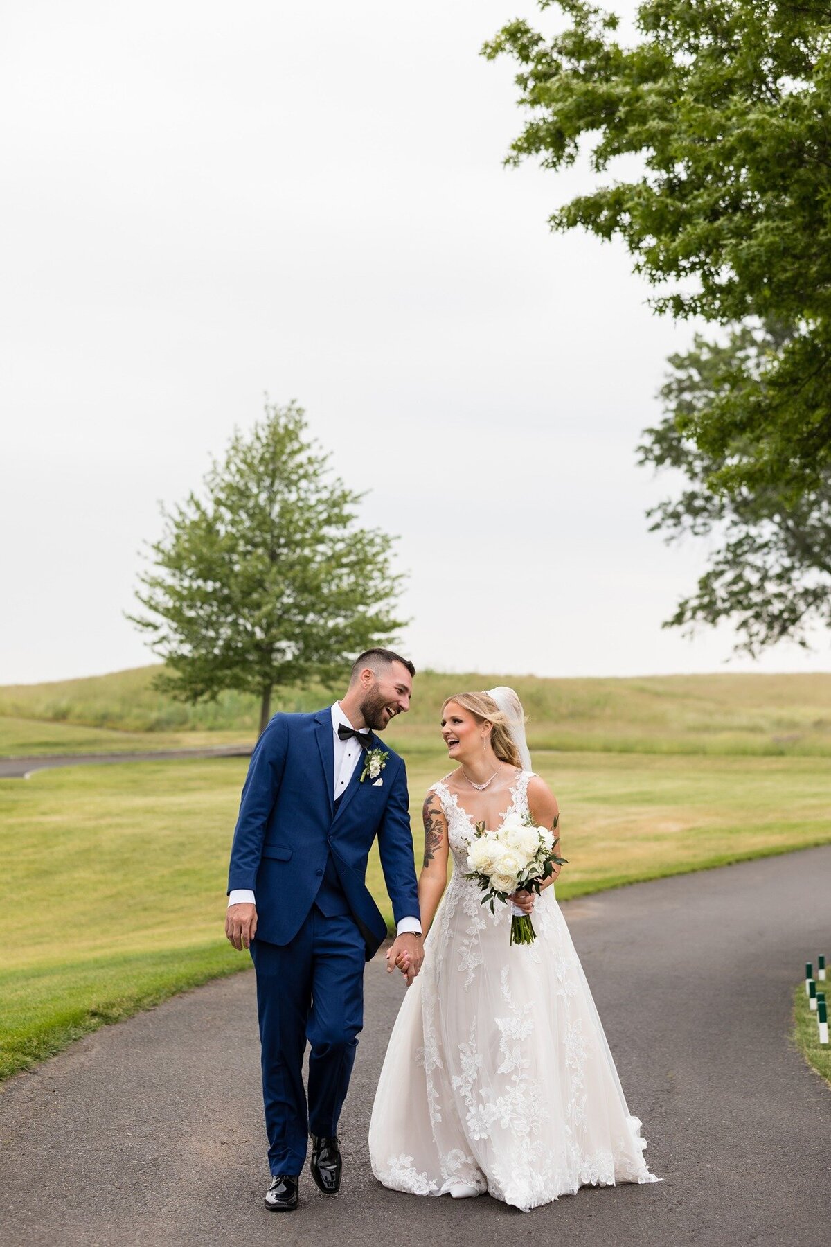bride-and-groom-walking-trump-national-golf-club