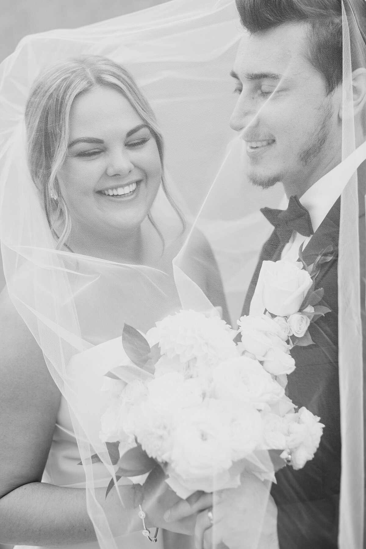 Bride and Groom under veil at wedding at The Westin