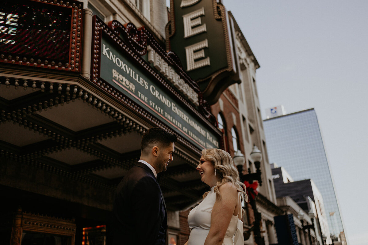bride and groom in front of the Tennessee theater