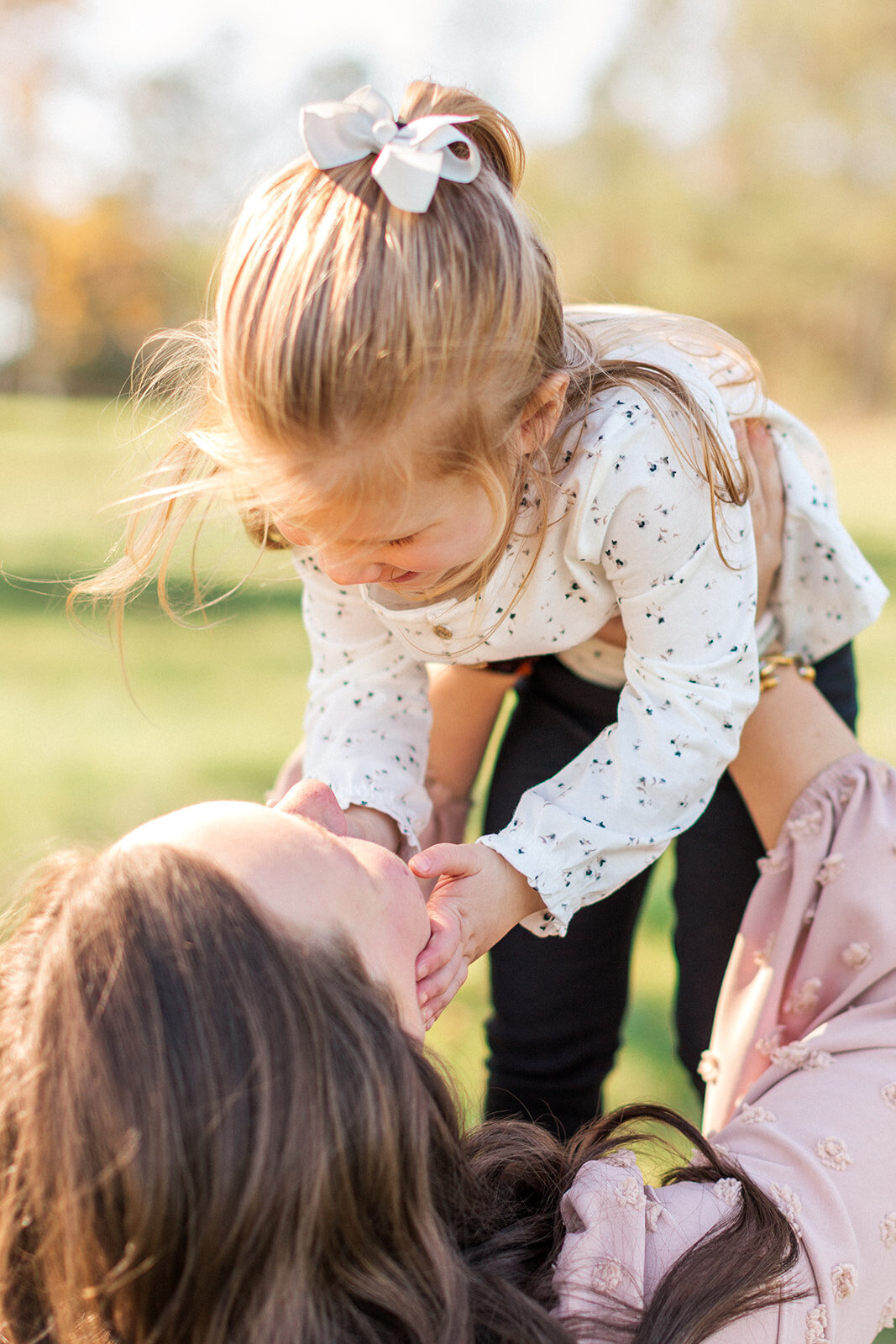 Big sister playing during newborn session