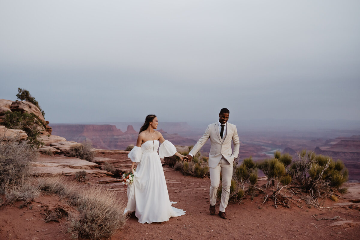 Utah Elopement Photographer captures bride and groom holding hands