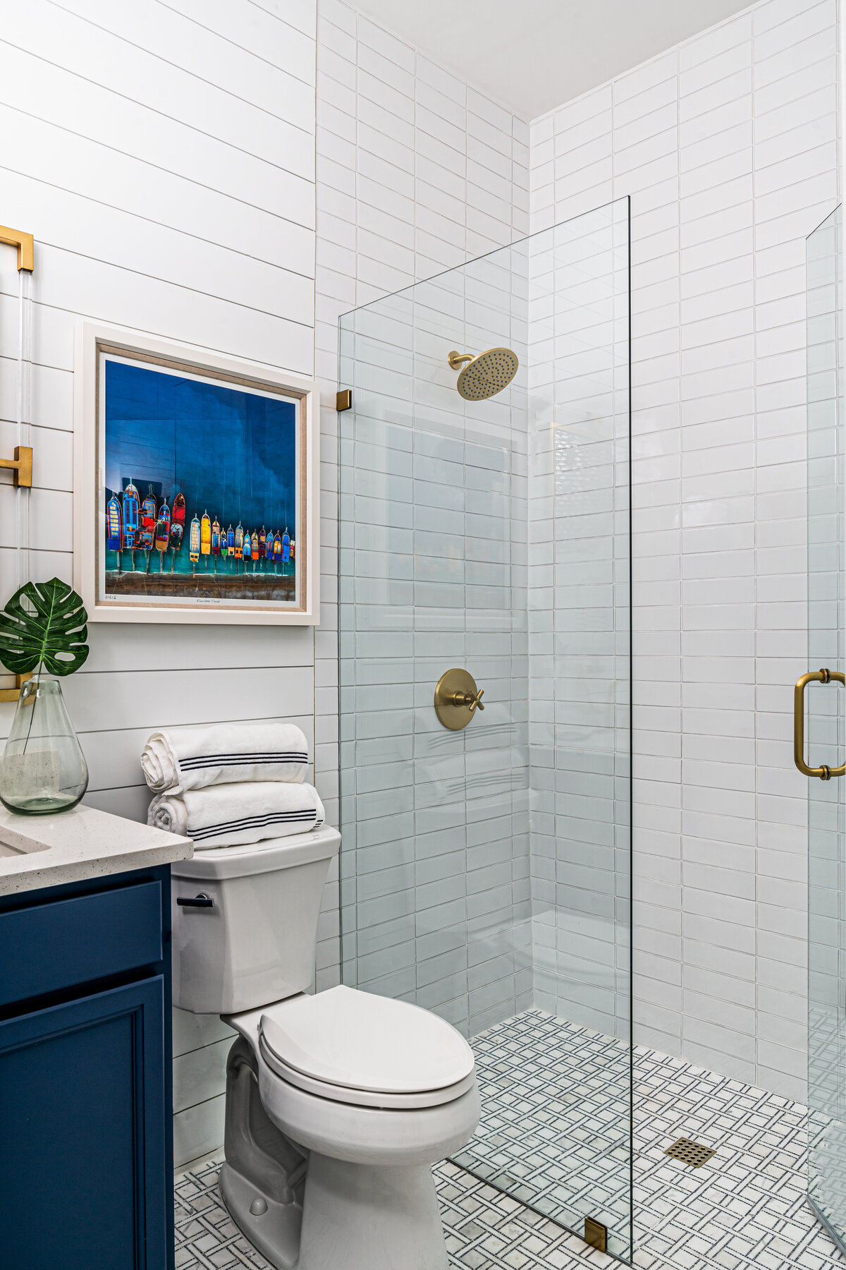 coastal home nautical guest bathroom with zero entry glass shower Full Service Interior Design by Island Home Interiors Lake Nona