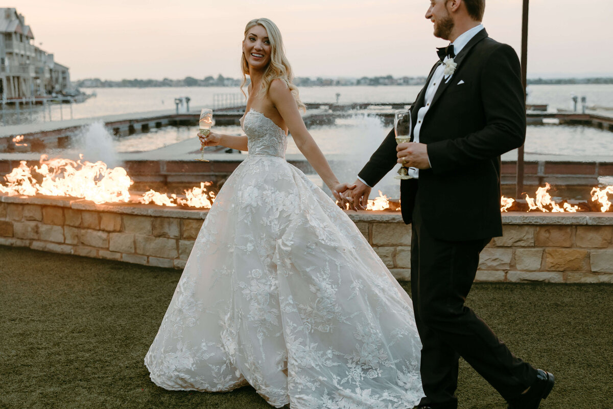 Sunset bridal beauty with long, loose curls and flawless wedding makeup. Book your San Antonio bridal hairdresser for waterfront weddings.