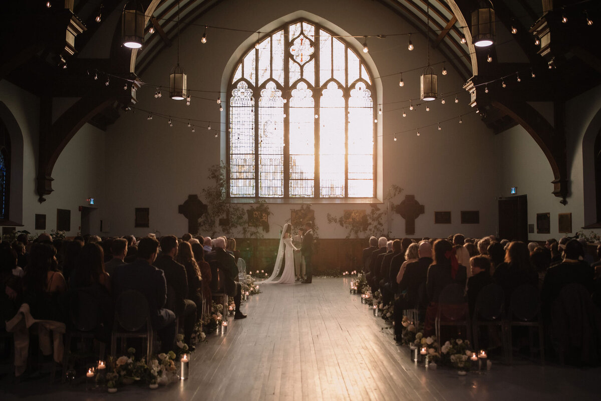 This breathtaking wedding at AllSaints Event Venue blends organic elements with modern, high fashion influences. Captured by Danielle Meredith Photography, the couple's chic style is evident in every detail, from the elegant floral arrangements to the sophisticated attire. The venue's contemporary design provides a stunning backdrop for the ceremony and reception, creating a seamless blend of natural beauty and high-end fashion. Keywords: organic wedding, modern wedding, high fashion wedding, AllSaints Event Venue, Danielle Meredith Photography, wedding photography, elegant wedding, contemporary wedding design.