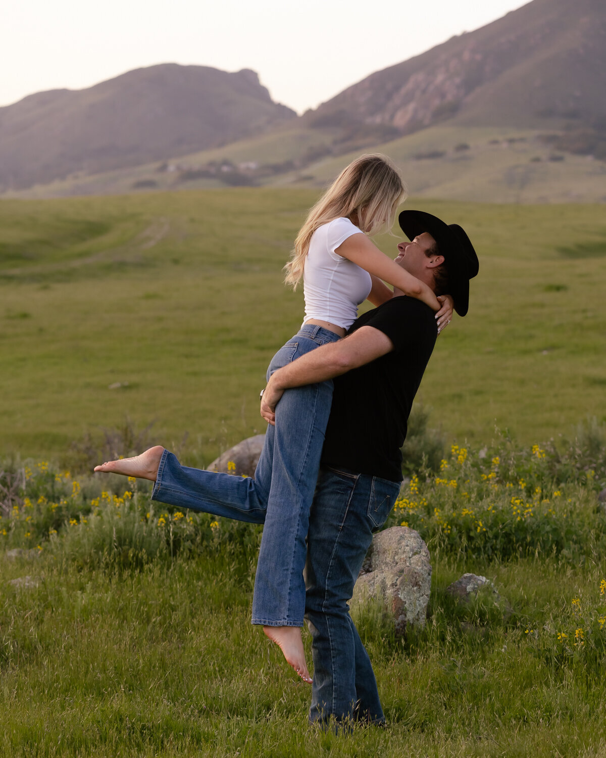 Candid couple kissing during engagement photos San Luis Obispo on Central Coast 