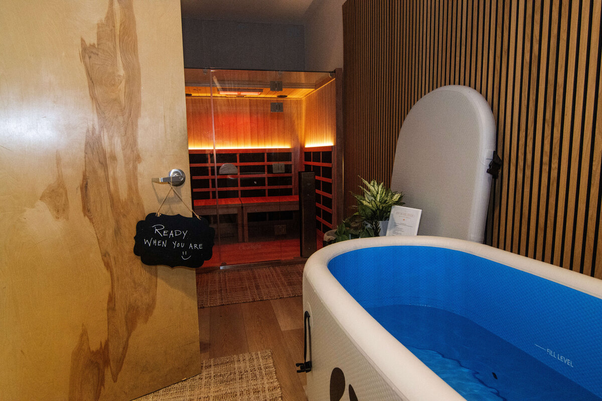 Close-up of a client performing upper body Lagree workout using Megaformer straps at Rise Lagree Studio in Poway, CA