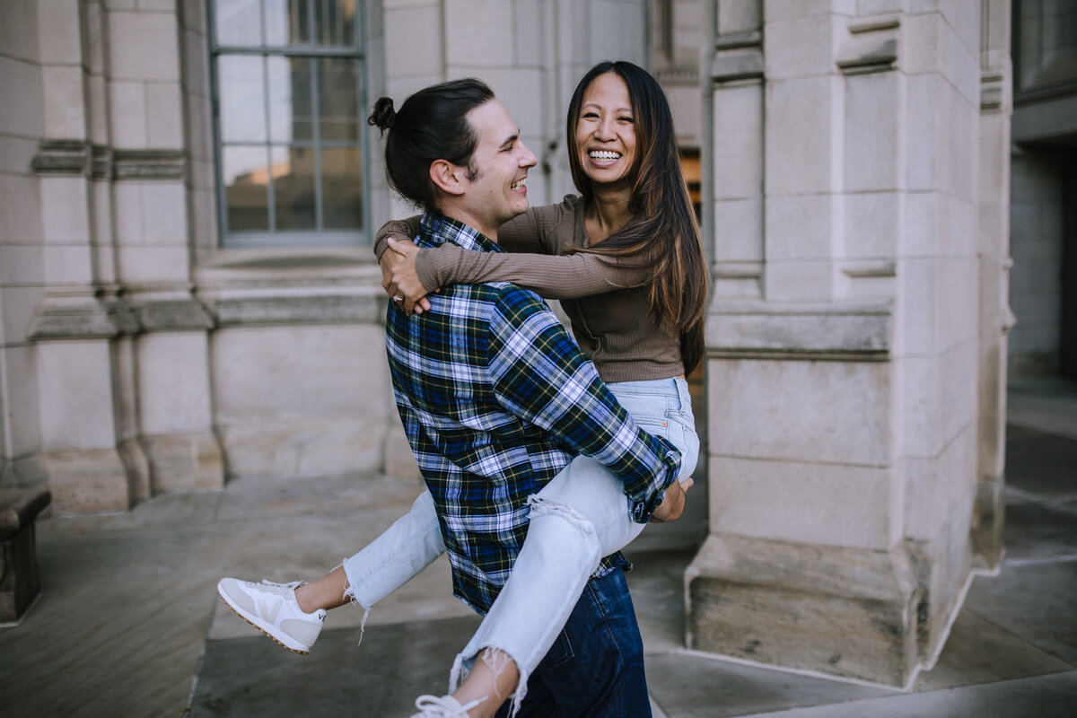 Engaged couple at the University of Pittsburgh outside the Cathedral of Learning.