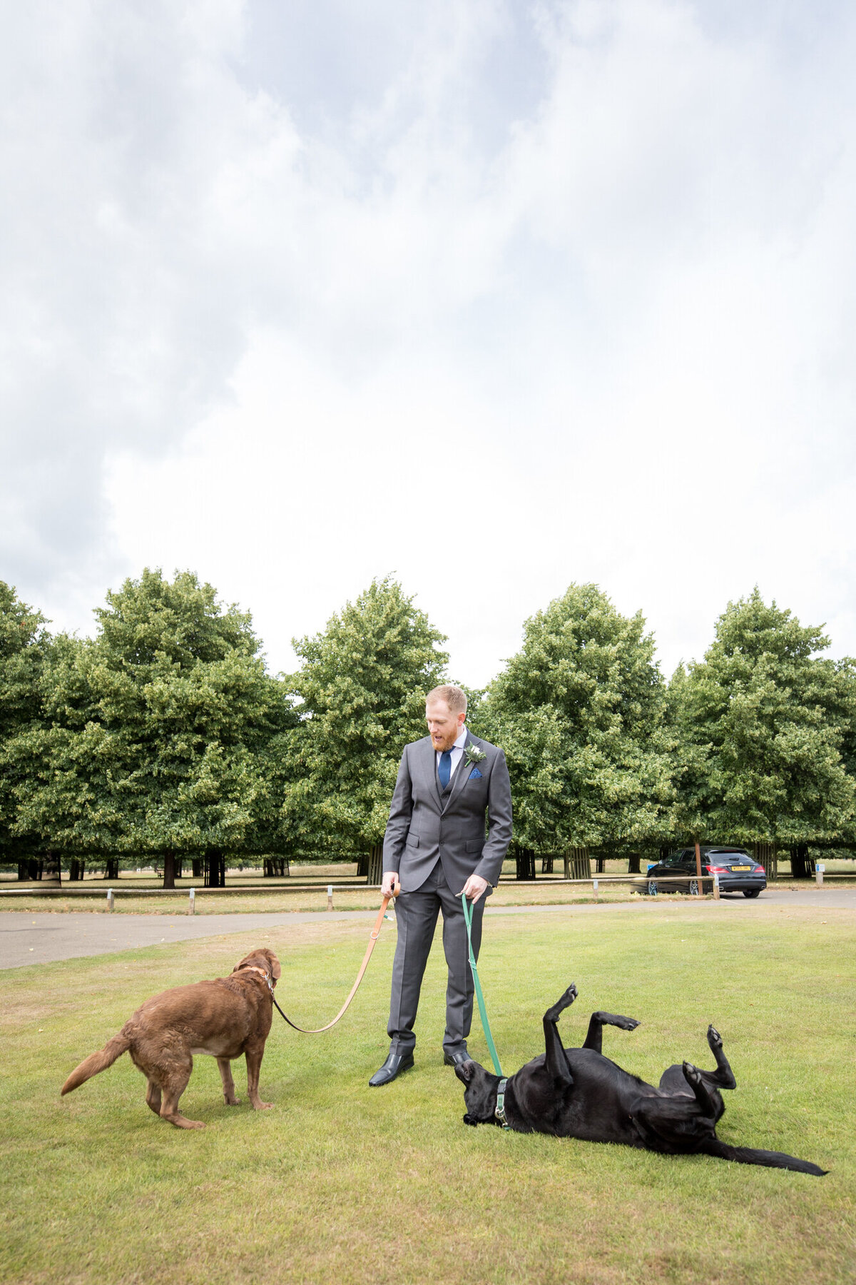 Groom with his dogs before ceremony