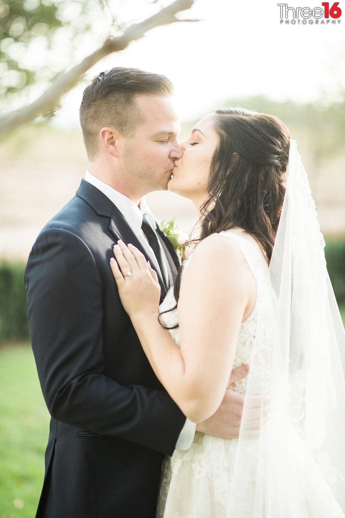 Bride and Groom share a tender kiss