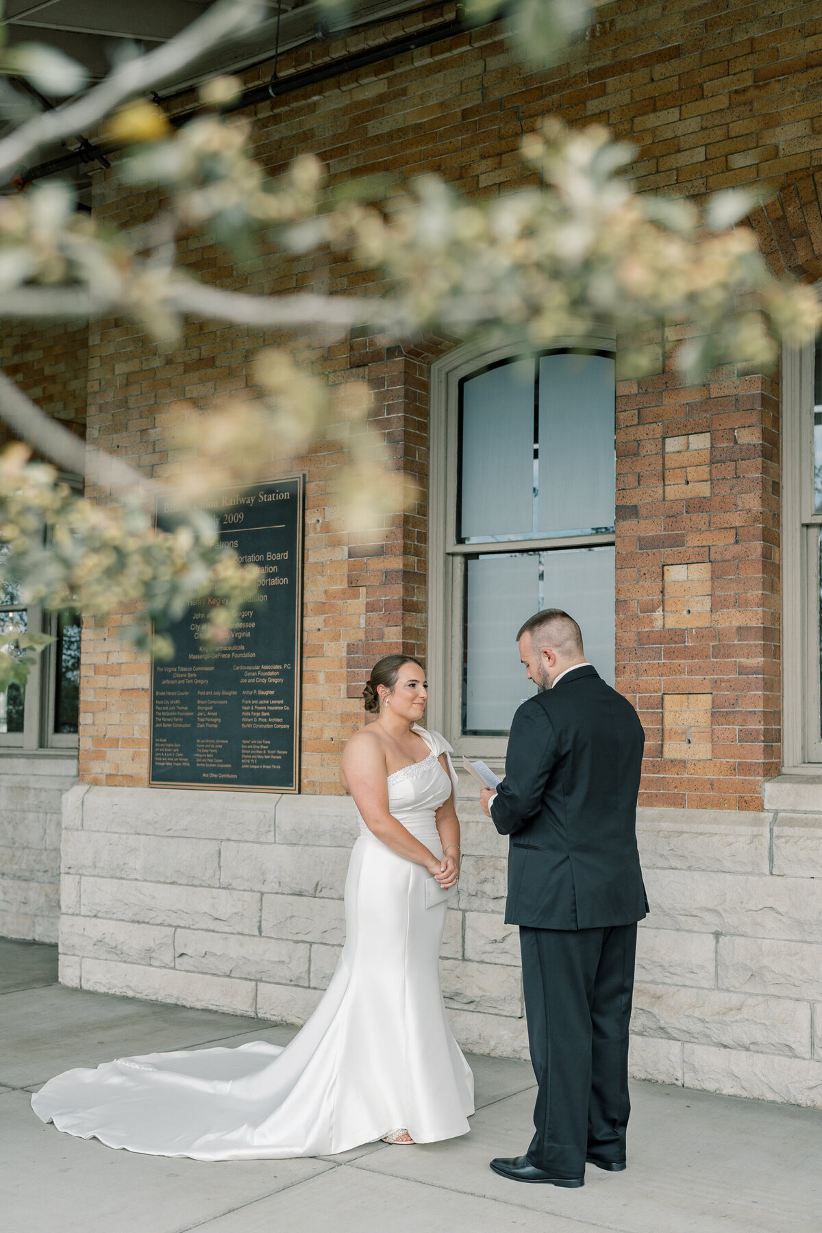 Bride and groom share private vows outside of the Bristol Train Station