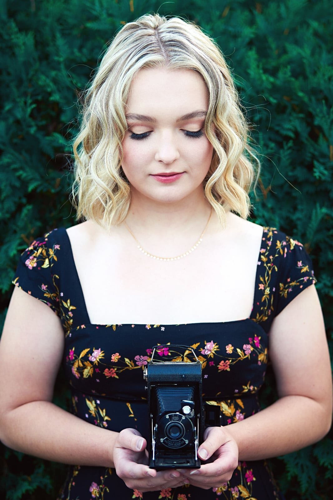 Elegant Senior Picture Photographer With Vintage Camera Outdoors-37