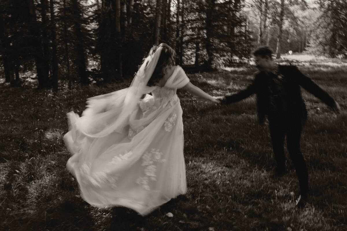 Alberta couple dancing in the forest on their wedding day