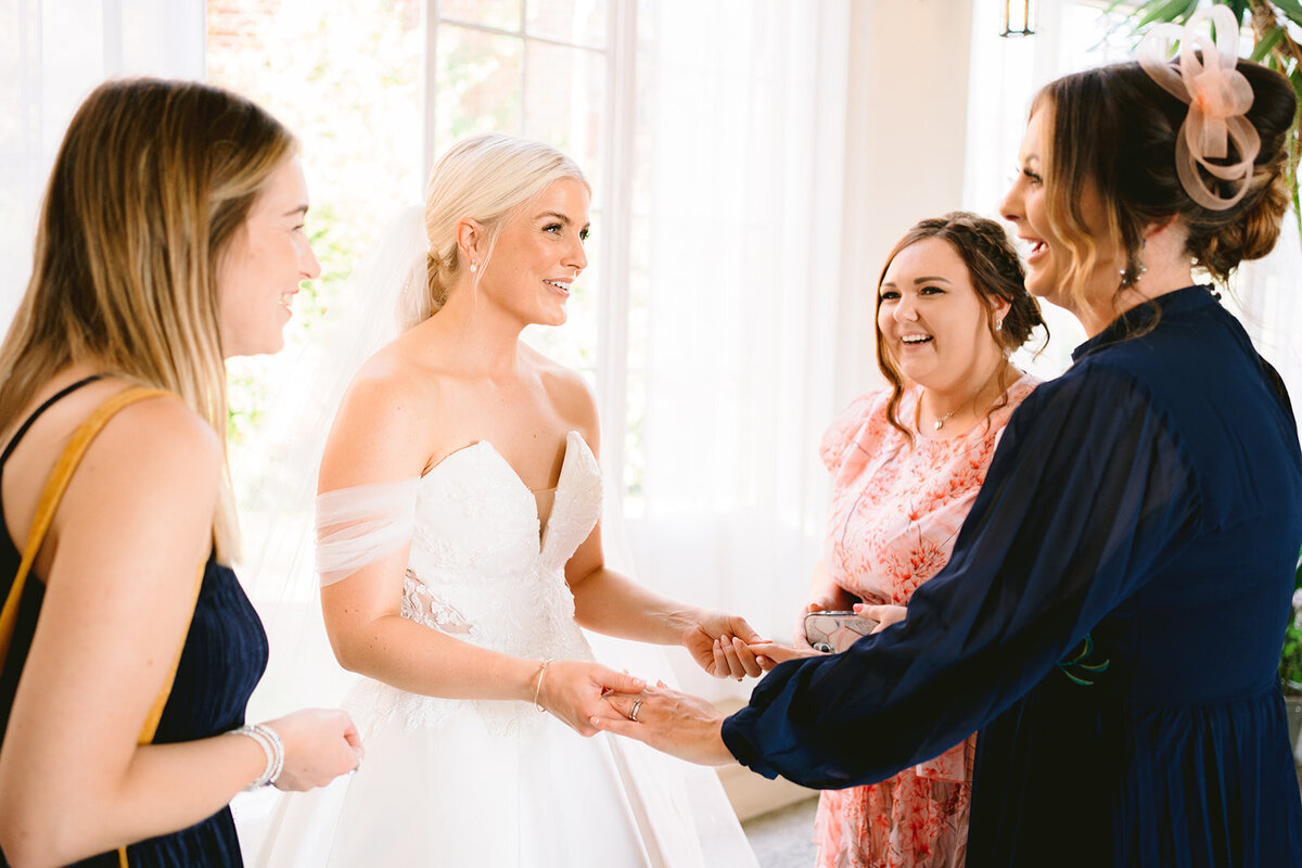 natural photo of the bride with guests
